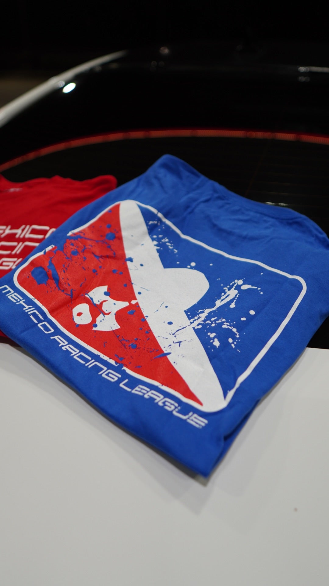 Close-up of a logo on a vehicle with a red, white, and blue design.