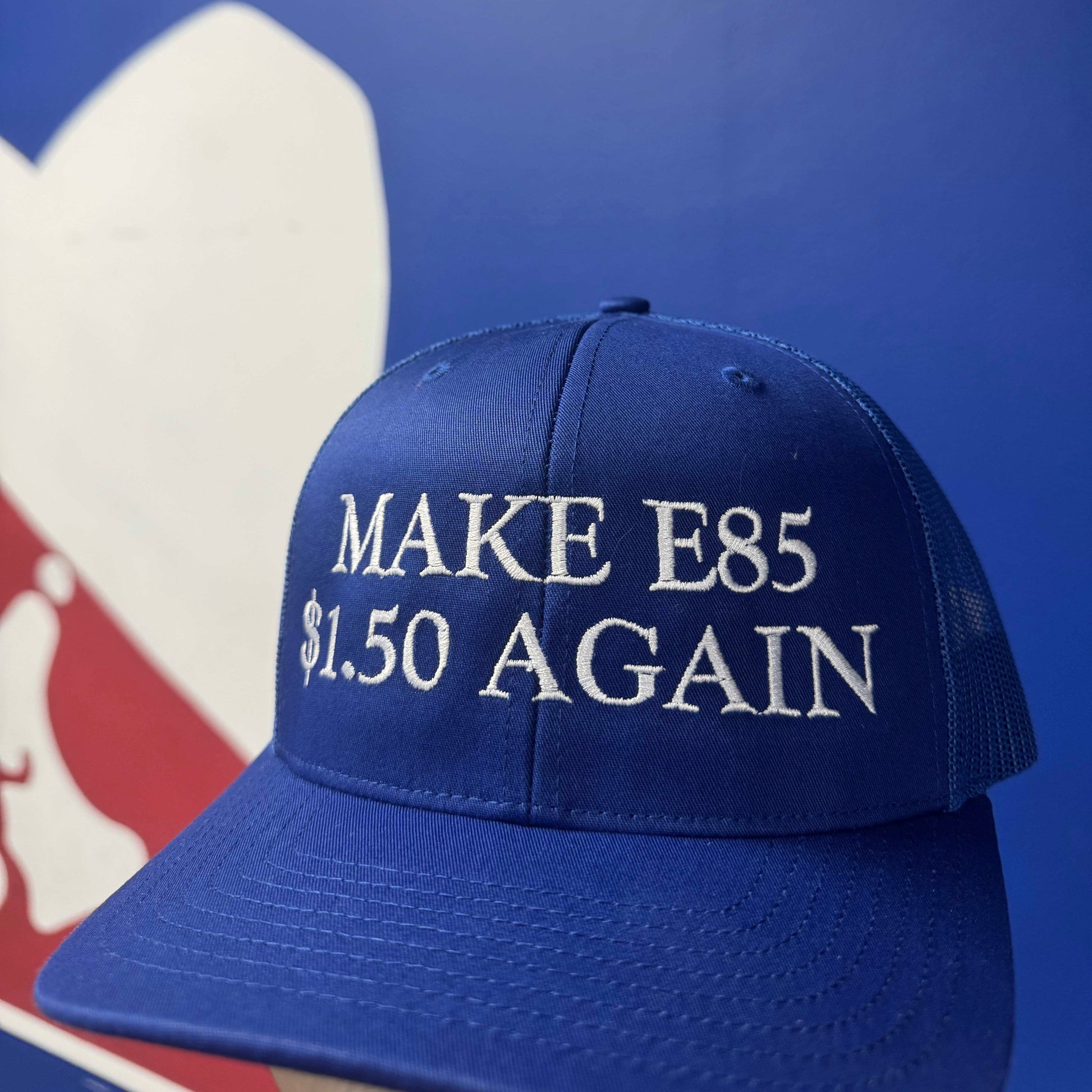 Blue cap with 'MAKE E85 $1.50 AGAIN' text against a blue background
